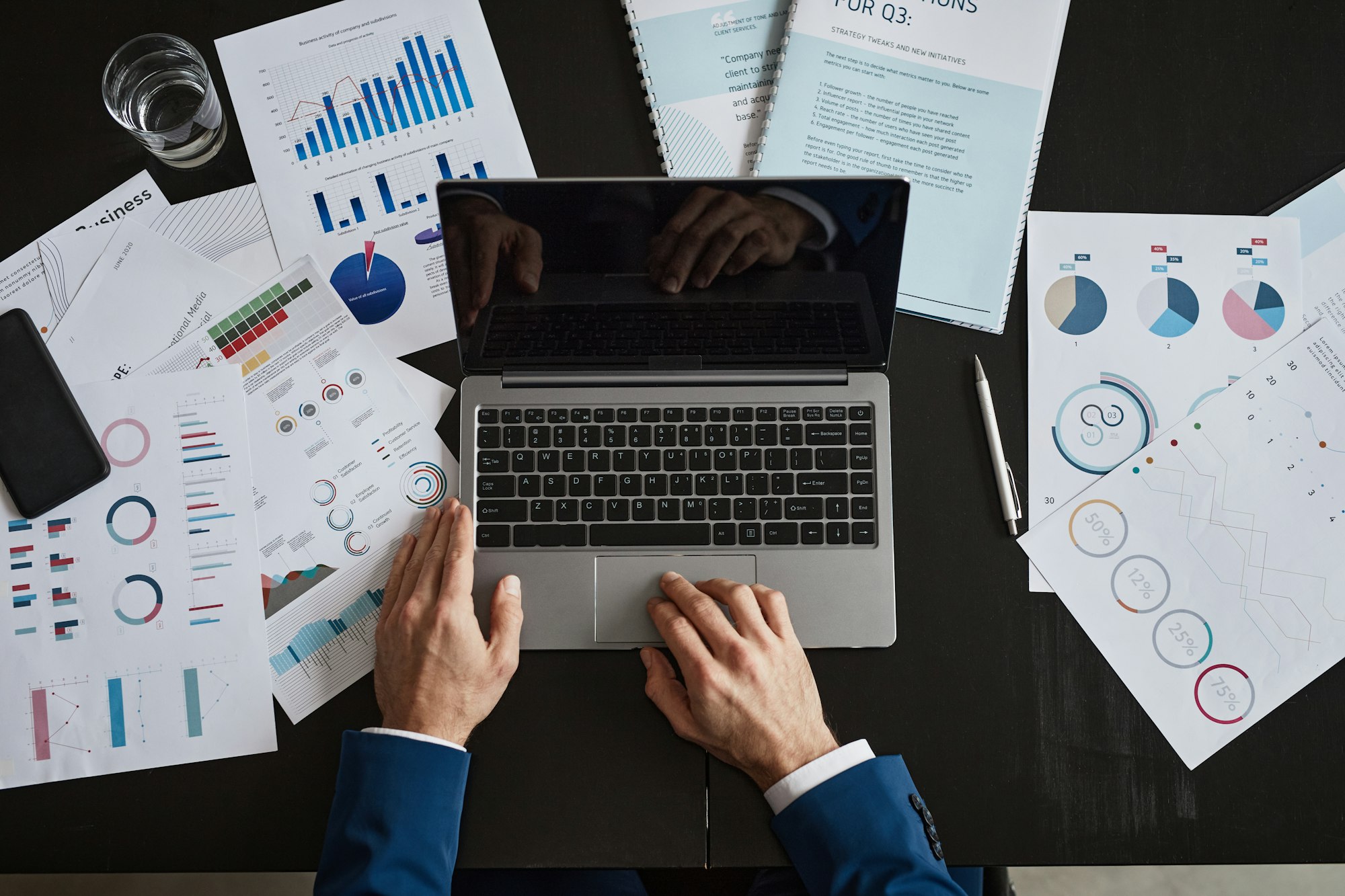 Businessman Using Laptop at Desk Top View